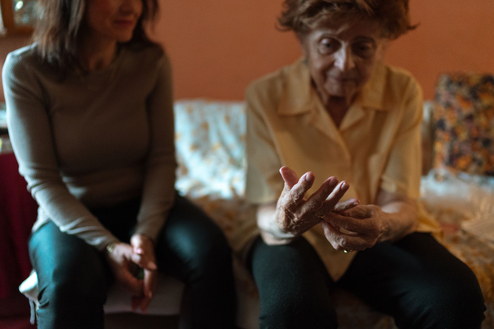 A companion and older adult sharing a warm conversation